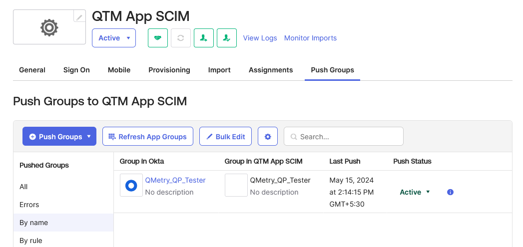 Group Successfully Linked Between Okta and QTM App SCIM Okta Push Groups to QTM App SCIM page displaying the QMetry_QP_Tester group under the “By name” section. The table shows the group linked in both Okta and QTM App SCIM, with the Push Status marked as Active and the Last Push timestamp confirming successful synchronization.