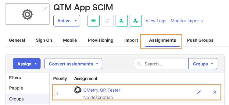 QTM App SCIM Group Assignment Confirmed Okta QTM App SCIM application page under the Assignments tab showing that the QMetry_QP_Tester group has been successfully assigned. The group appears in the assignments list with editable and remove options available.